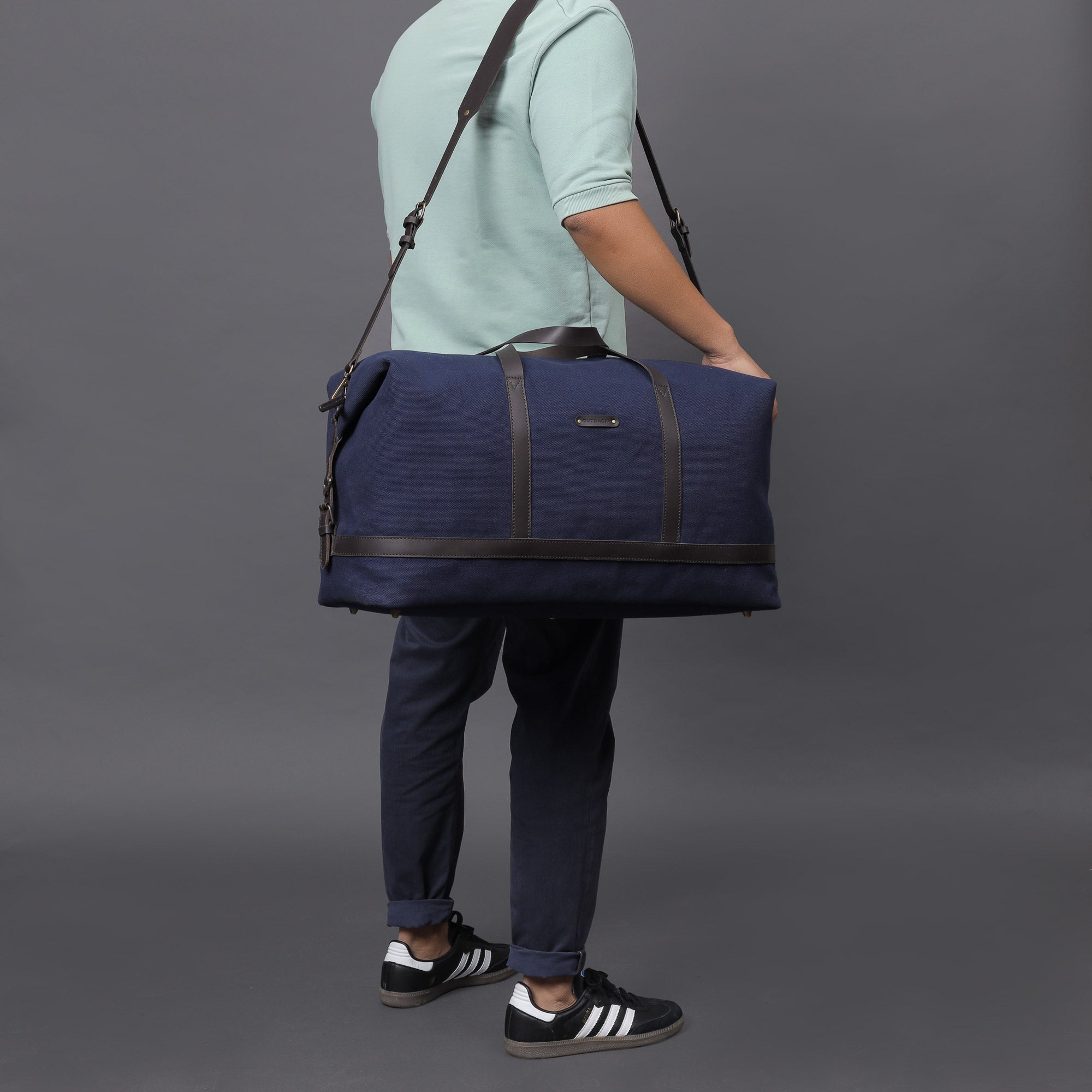 Runway Canvas Travel Bag showcasing its vintage design, adjustable strap, and durable materials, perfect for stylish travel.