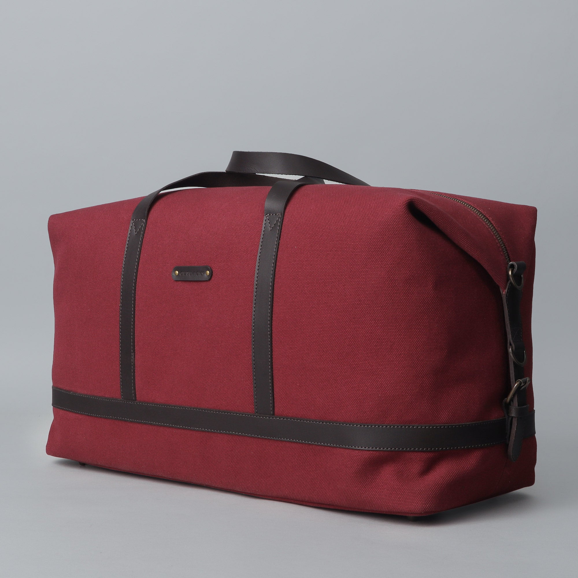 Runway Canvas Travel Bag showcasing its vintage design, adjustable shoulder strap, and durable materials.