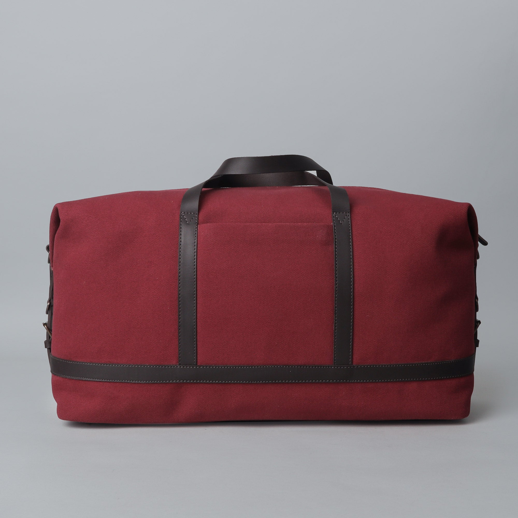 Runway Canvas Travel Bag showcasing its vintage design, adjustable shoulder strap, and durable materials.