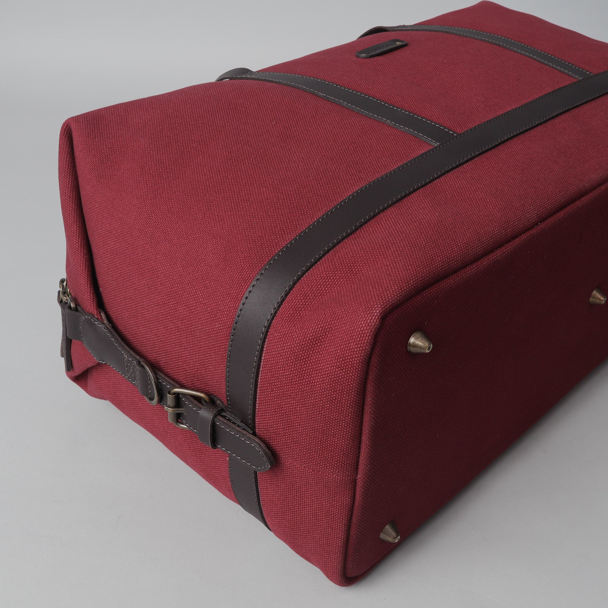 Runway Canvas Travel Bag showcasing its vintage design, adjustable shoulder strap, and durable materials.