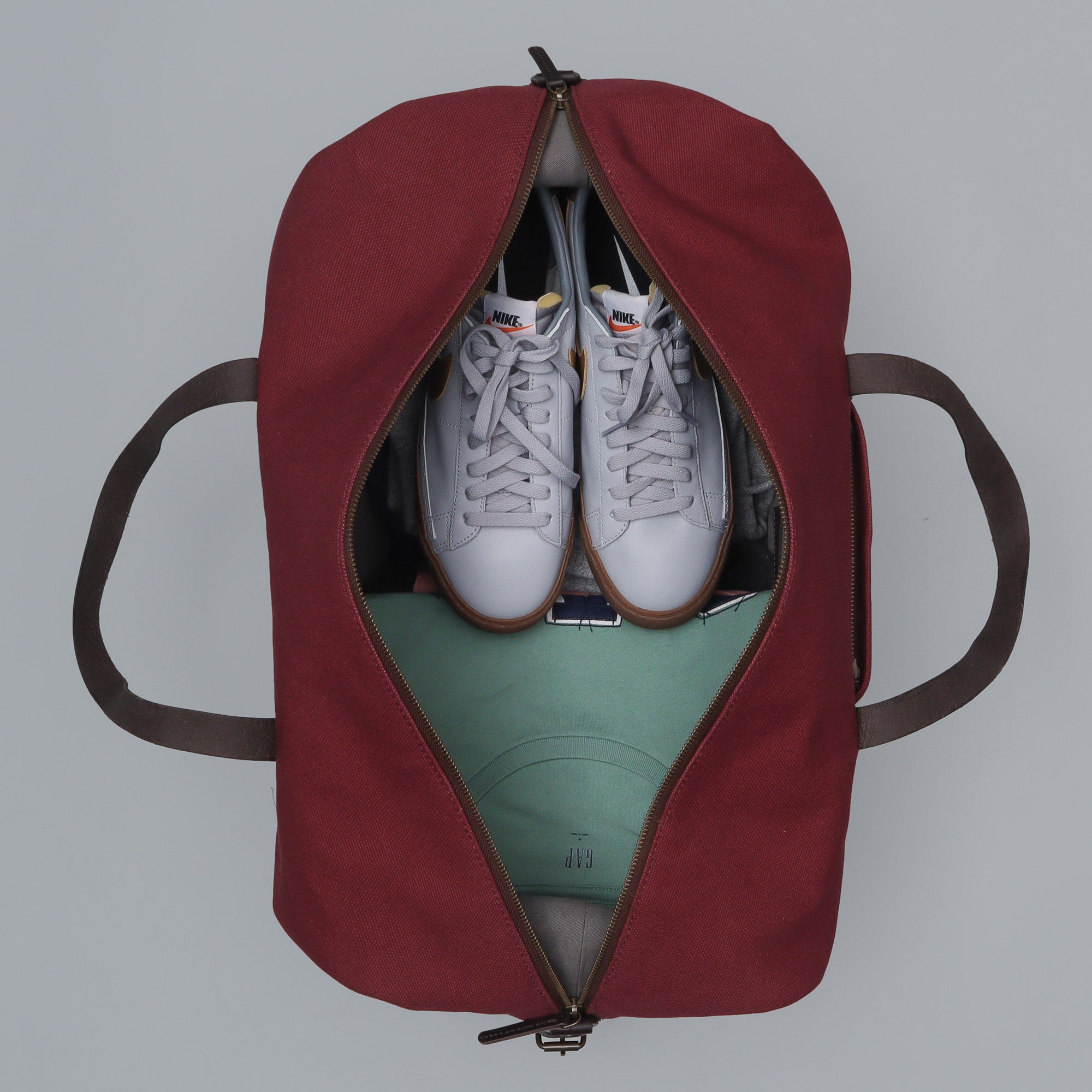 Runway Canvas Travel Bag showcasing its vintage design, adjustable shoulder strap, and durable materials.