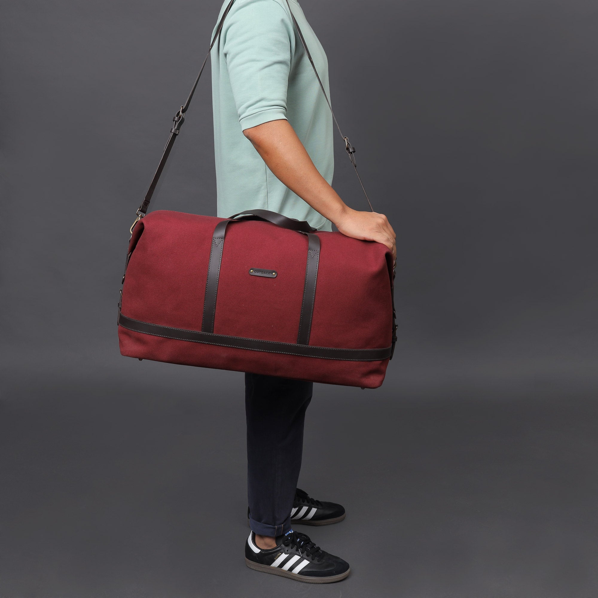 Runway Canvas Travel Bag showcasing its vintage design, adjustable shoulder strap, and durable materials.