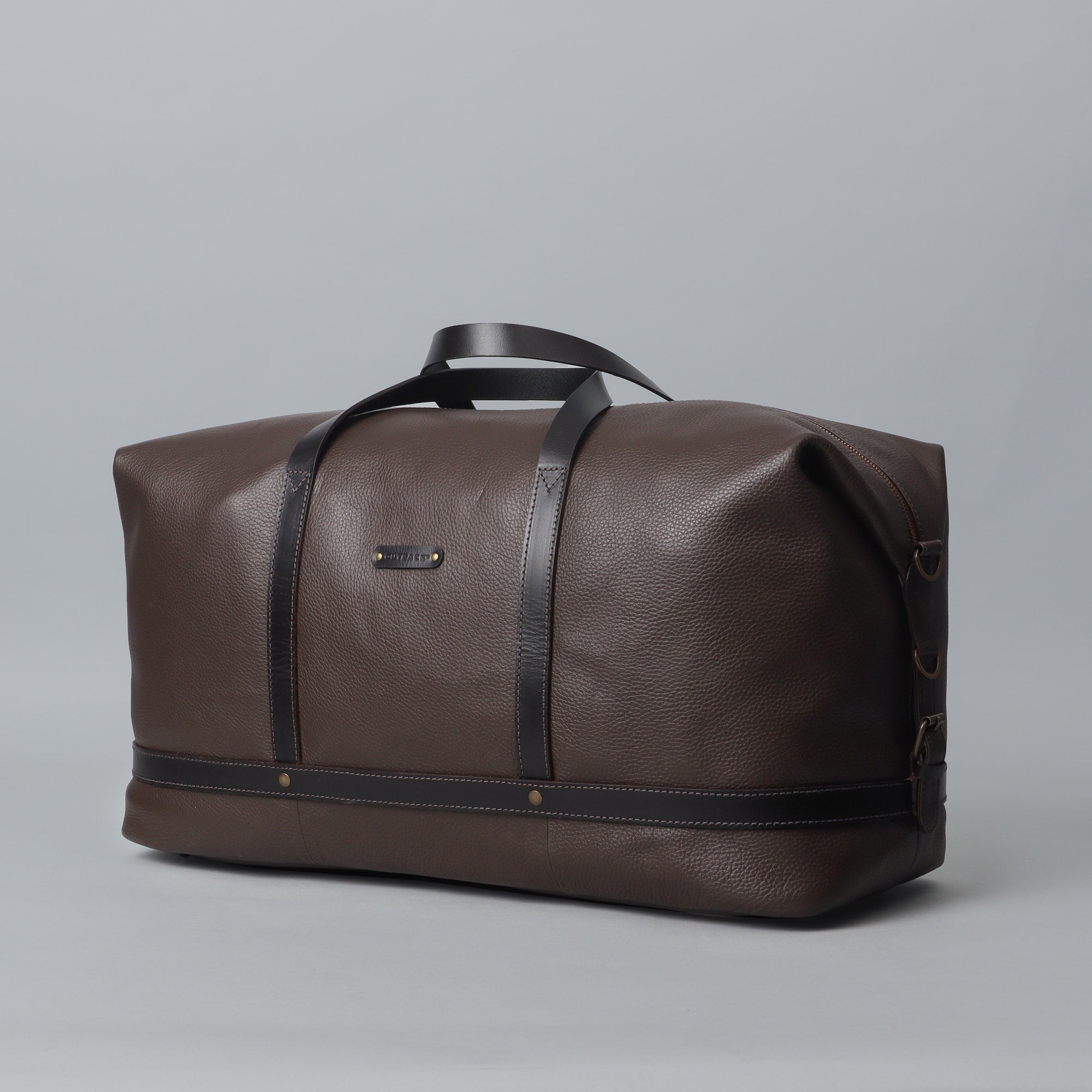 Runway Leather Travel Bag made from premium full grain leather, featuring adjustable shoulder strap, vintage buckles, and durable interior.