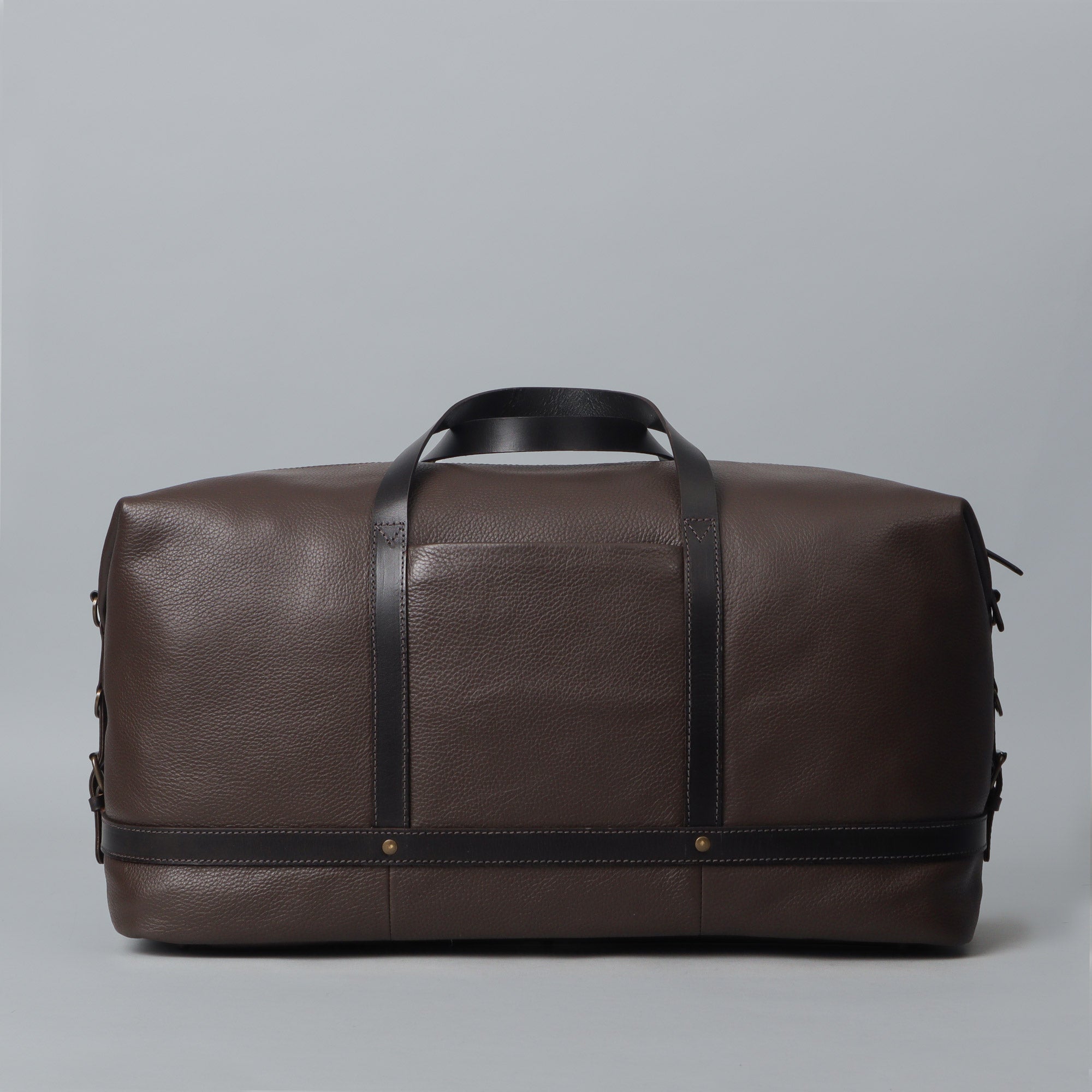 Runway Leather Travel Bag made from premium full grain leather, featuring adjustable shoulder strap, vintage buckles, and durable interior.