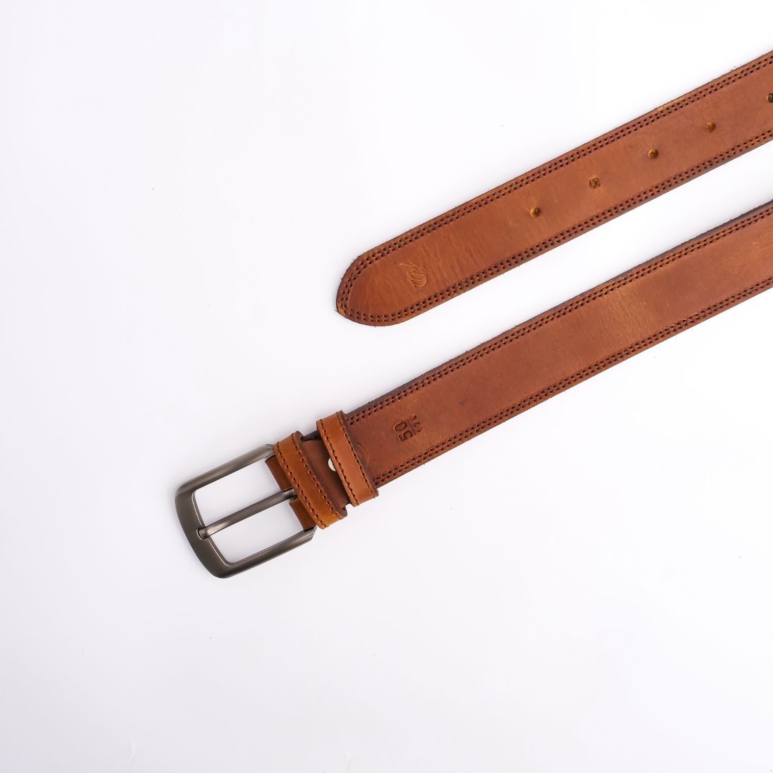 A rustic leather belt with double thread stitching and a single pin buckle, showcasing its quality and style.