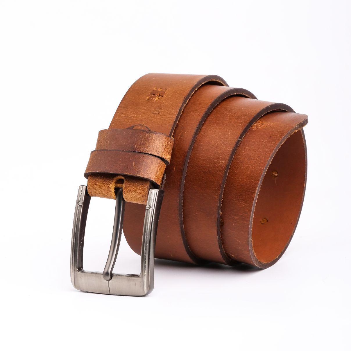 A rustic leather belt with double thread stitching and a single pin buckle, showcasing its quality and style.