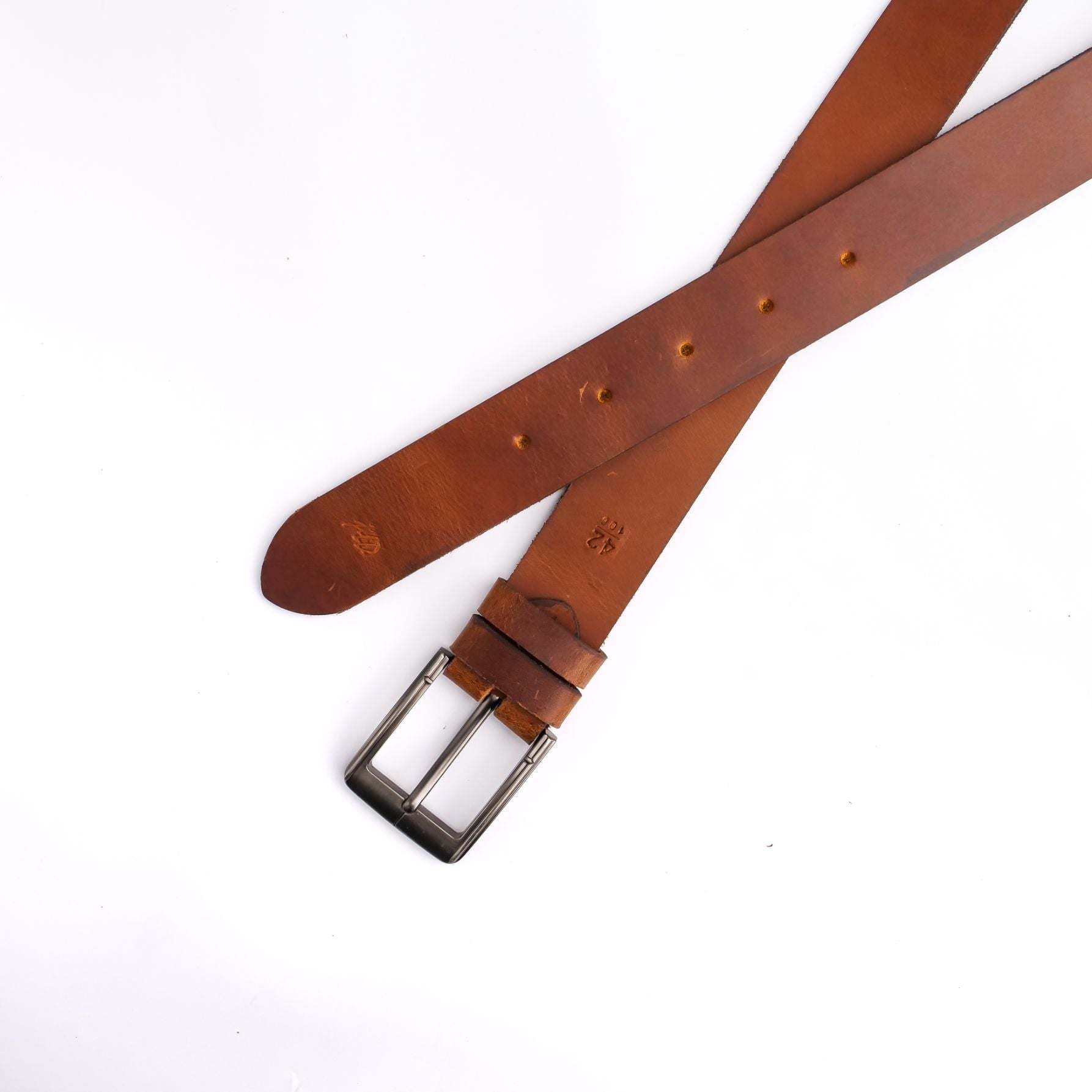 A rustic leather belt with double thread stitching and a single pin buckle, showcasing its quality and style.