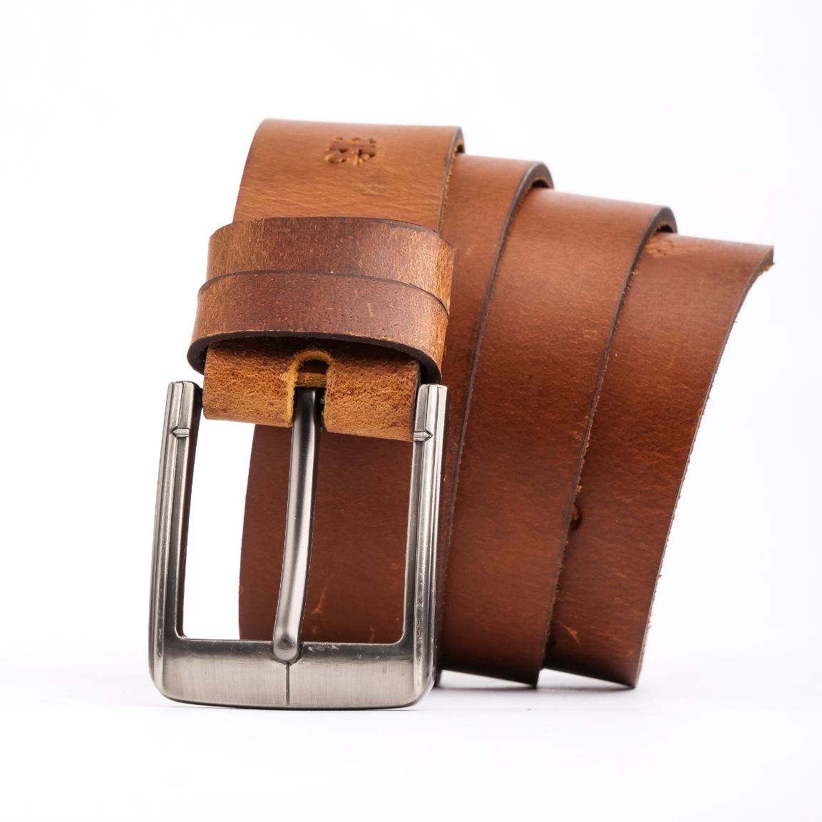 A rustic leather belt with double thread stitching and a single pin buckle, showcasing its quality and style.