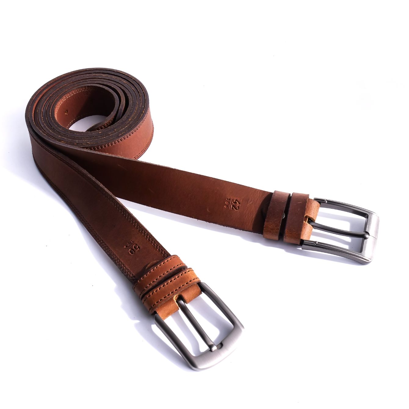 A rustic leather belt with double thread stitching and a single pin buckle, showcasing its quality and style.