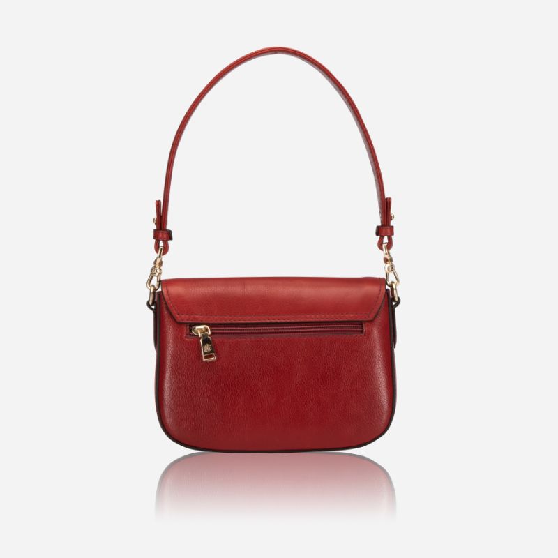 A vibrant red saddle bag featuring RFID protection, showcasing its stylish design and compact size.