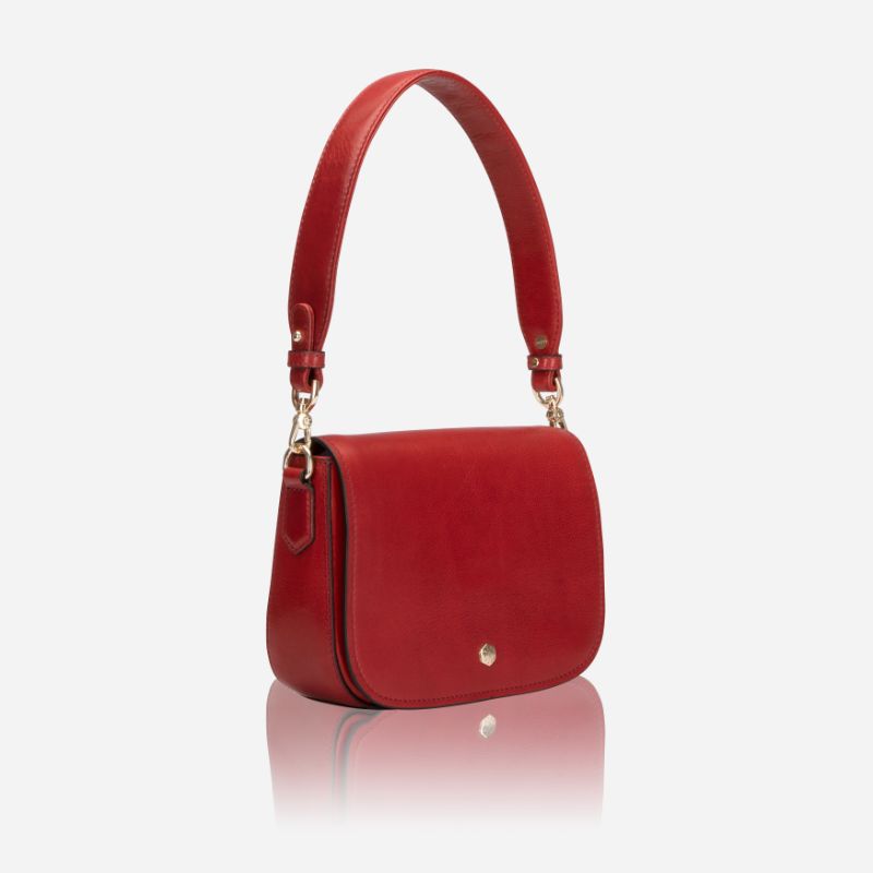 A vibrant red saddle bag featuring RFID protection, showcasing its stylish design and compact size.