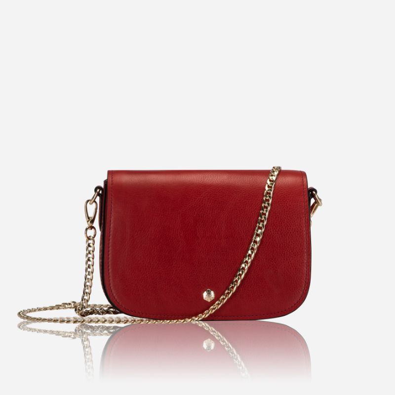 A vibrant red saddle bag featuring RFID protection, showcasing its stylish design and compact size.