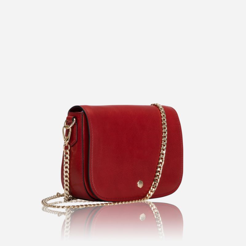 A vibrant red saddle bag featuring RFID protection, showcasing its stylish design and compact size.