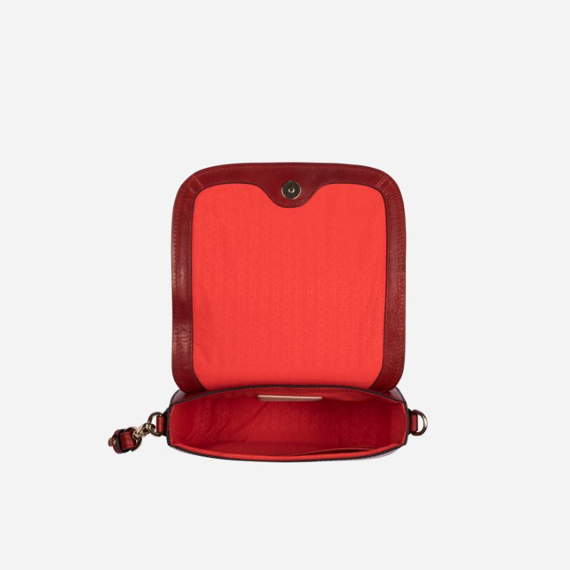 A vibrant red saddle bag featuring RFID protection, showcasing its stylish design and compact size.