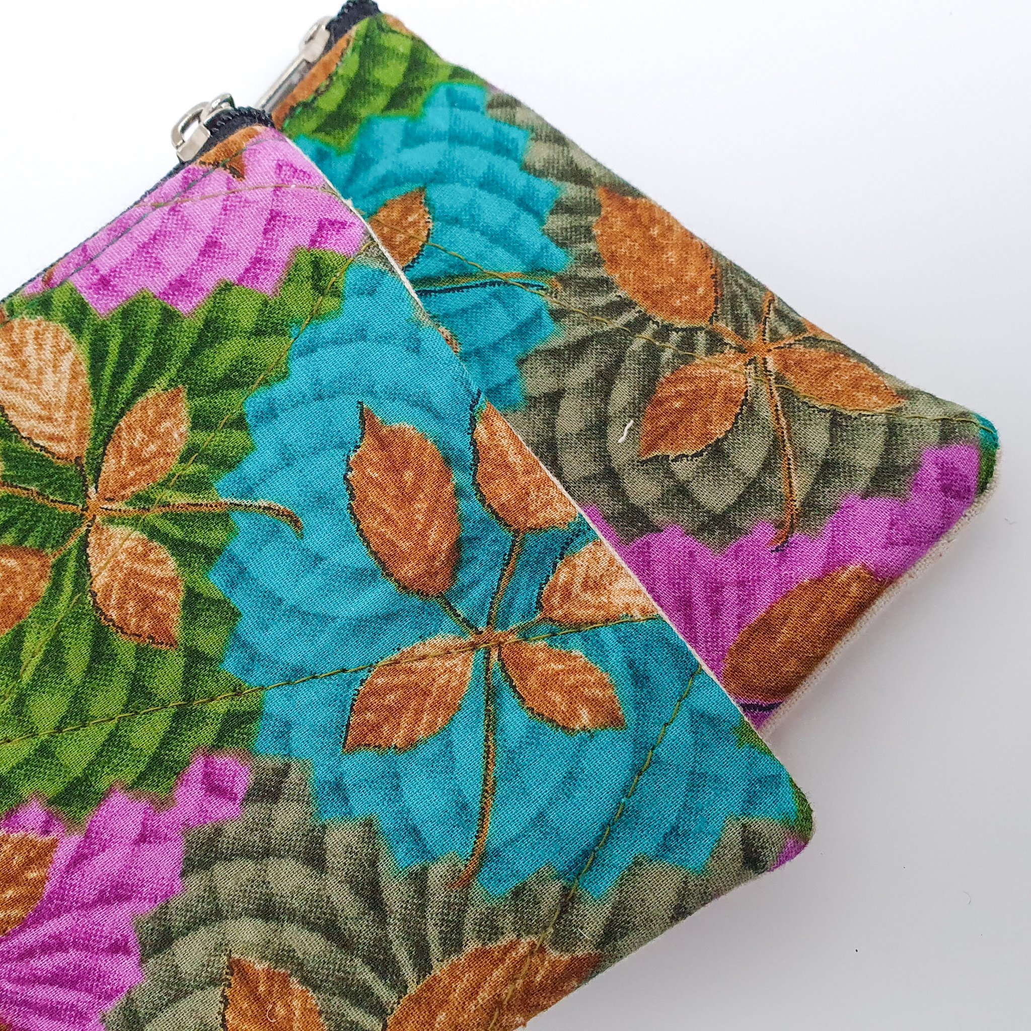 Colorful Sari coin purses made from reclaimed fabric, showcasing unique patterns and designs, ethically handmade by artisans in India.