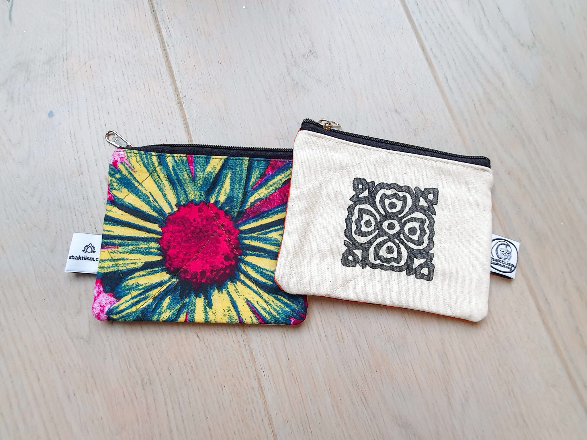 Colorful Sari coin purses made from reclaimed fabric, showcasing unique patterns and designs, ethically handmade by artisans in India.