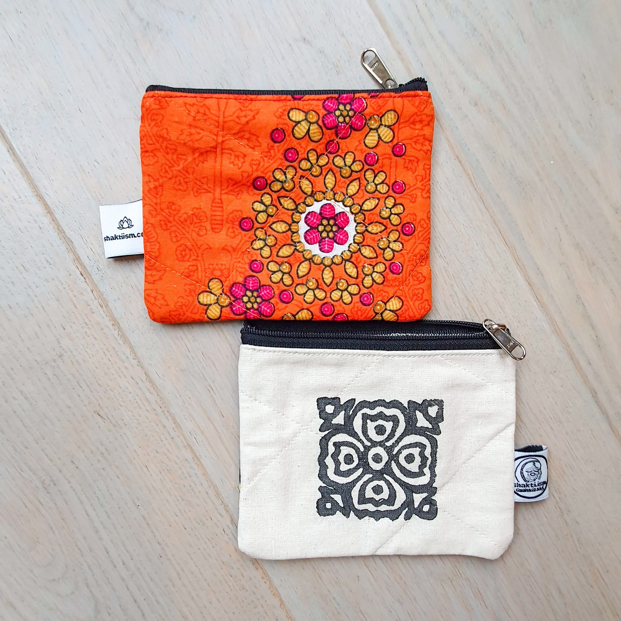 Colorful Sari coin purses made from reclaimed fabric, showcasing unique patterns and designs, ethically handmade by artisans in India.