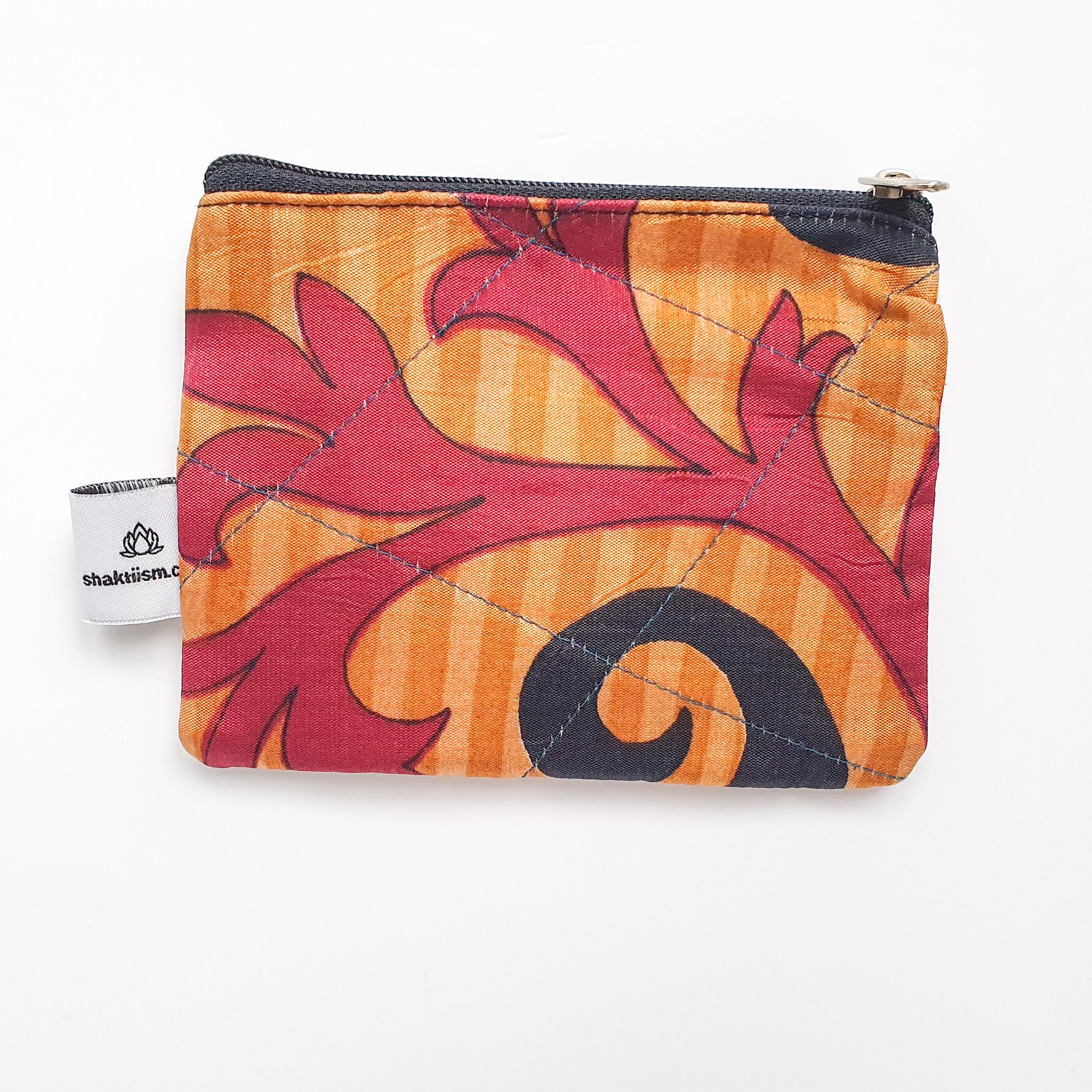 Colorful Sari coin purses made from reclaimed fabric, showcasing unique patterns and designs, ethically handmade by artisans in India.