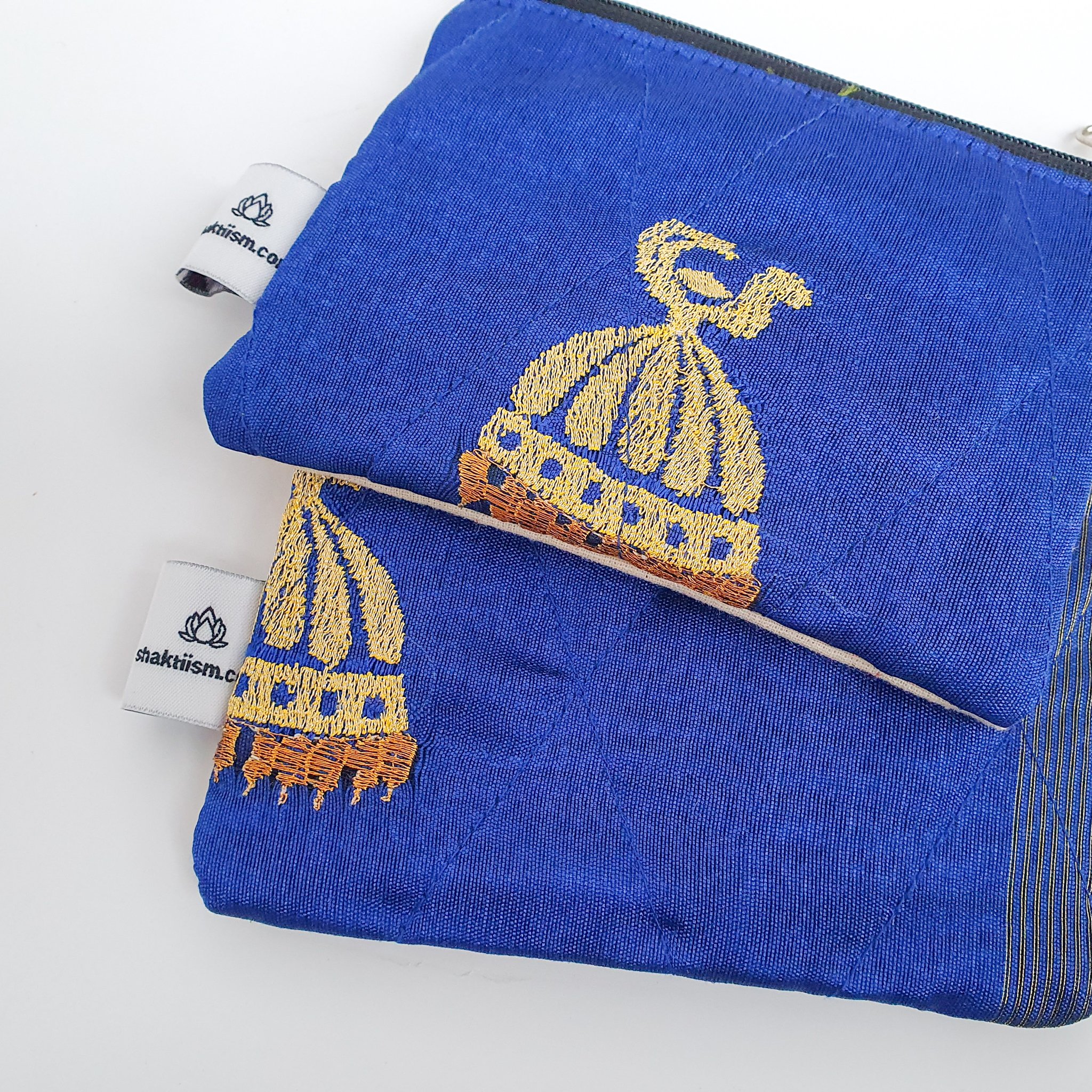 Colorful Sari coin purses made from reclaimed fabric, showcasing unique patterns and designs, ethically handmade by artisans in India.