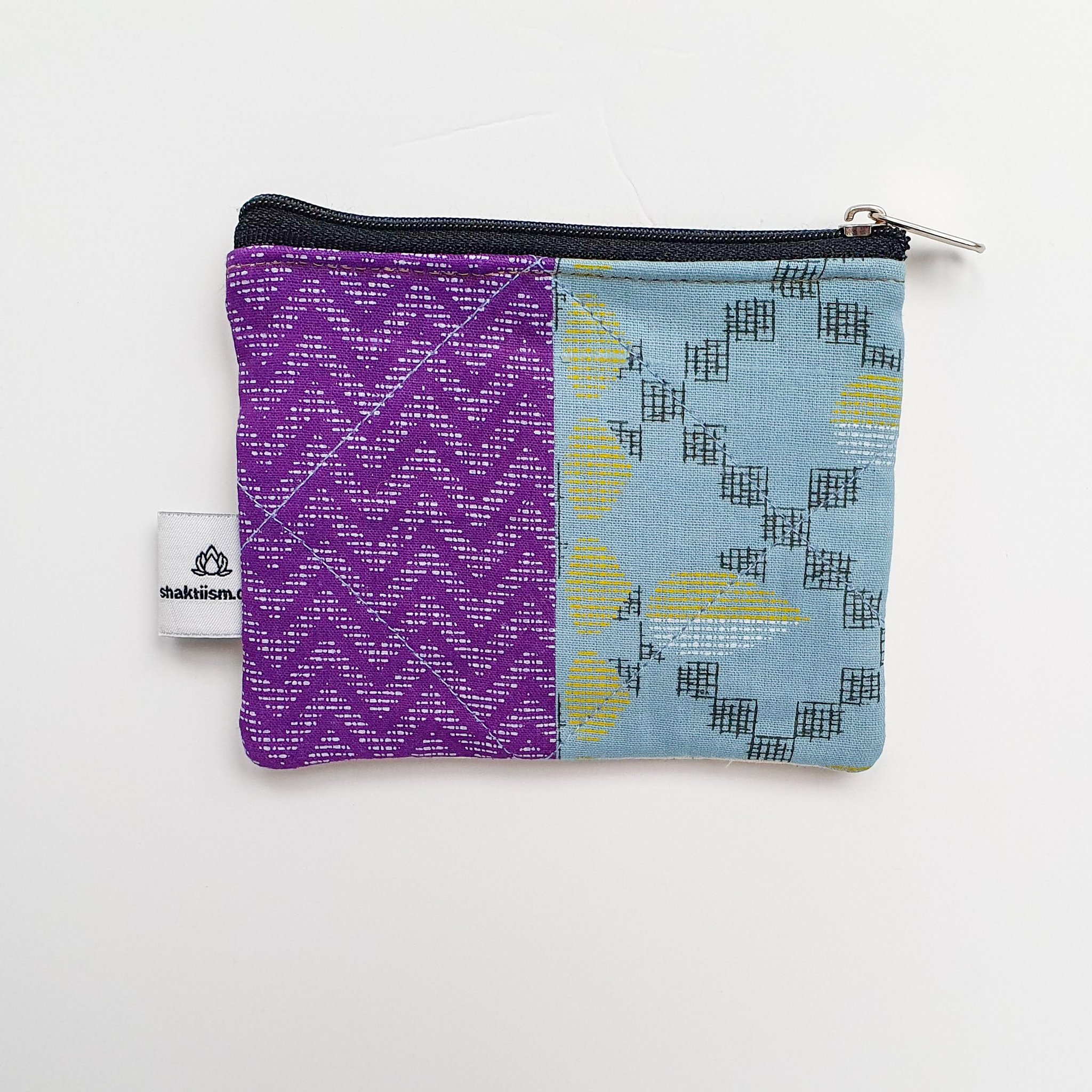 Colorful Sari coin purses made from reclaimed fabric, showcasing unique patterns and designs, ethically handmade by artisans in India.