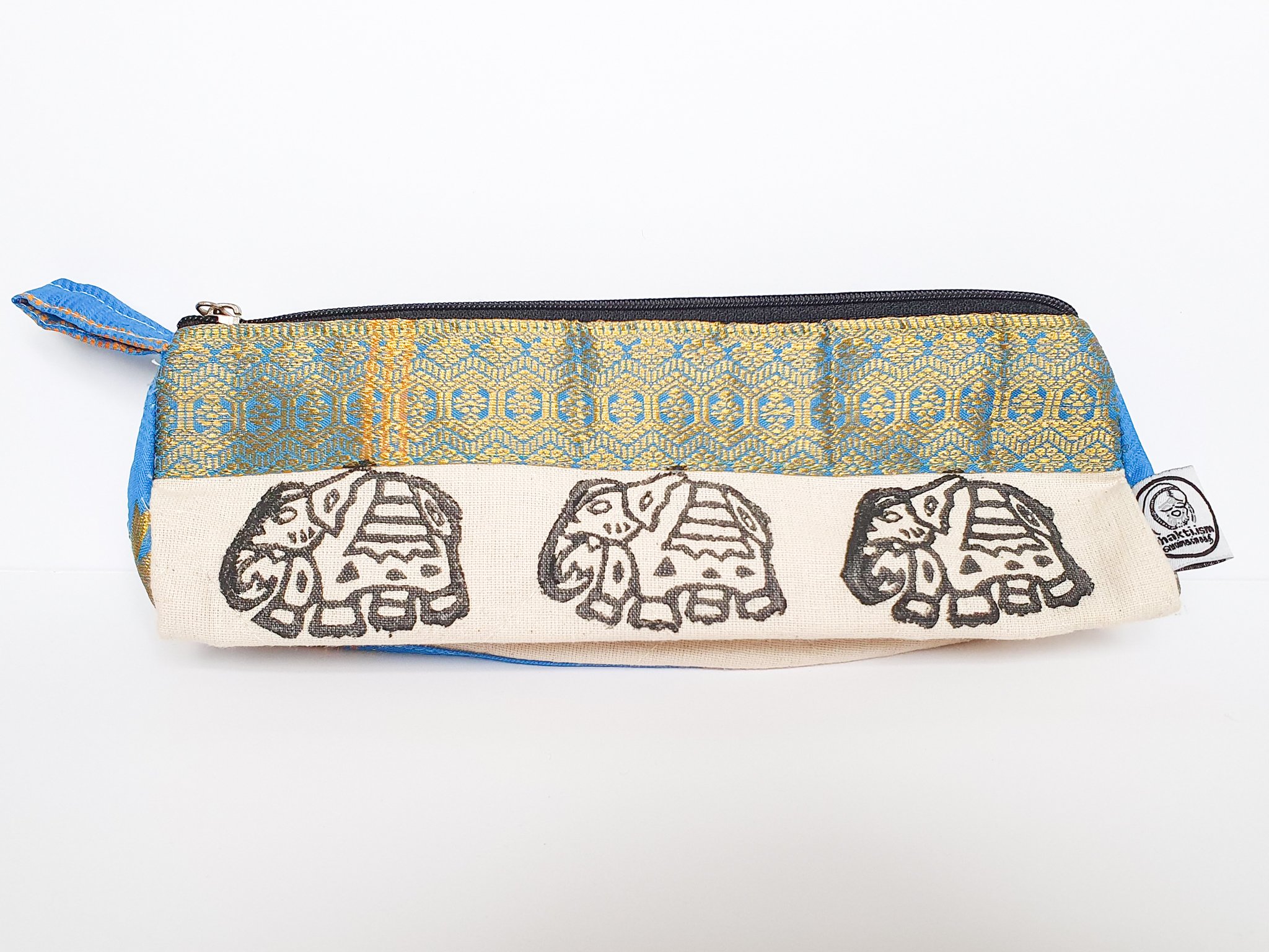 A vibrant Sari Pencil Pouch made from reclaimed sari fabric, showcasing unique patterns and colors, ethically handmade by artisans in India.