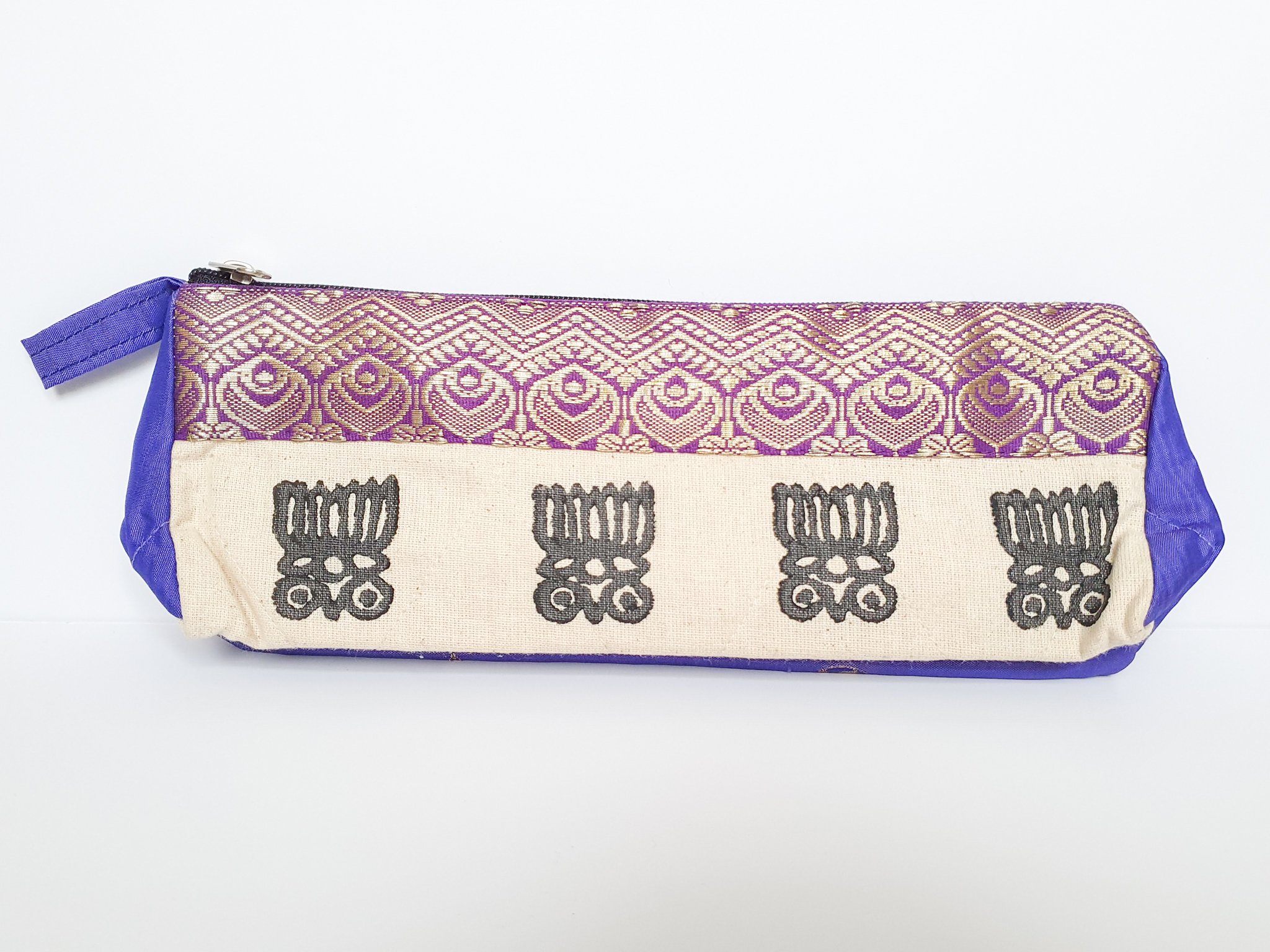 A vibrant Sari Pencil Pouch made from reclaimed sari fabric, showcasing unique patterns and colors, ethically handmade by artisans in India.