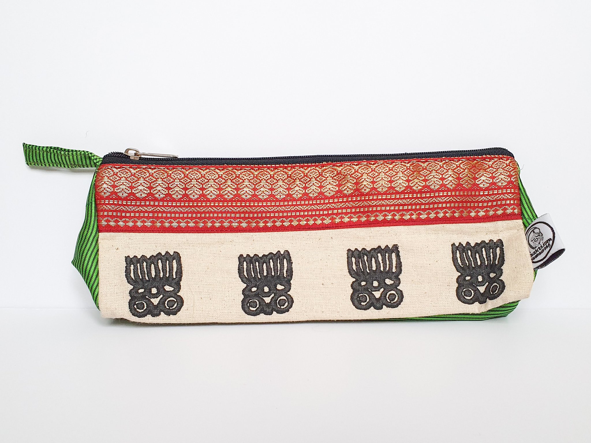 A vibrant Sari Pencil Pouch made from reclaimed sari fabric, showcasing unique patterns and colors, ethically handmade by artisans in India.