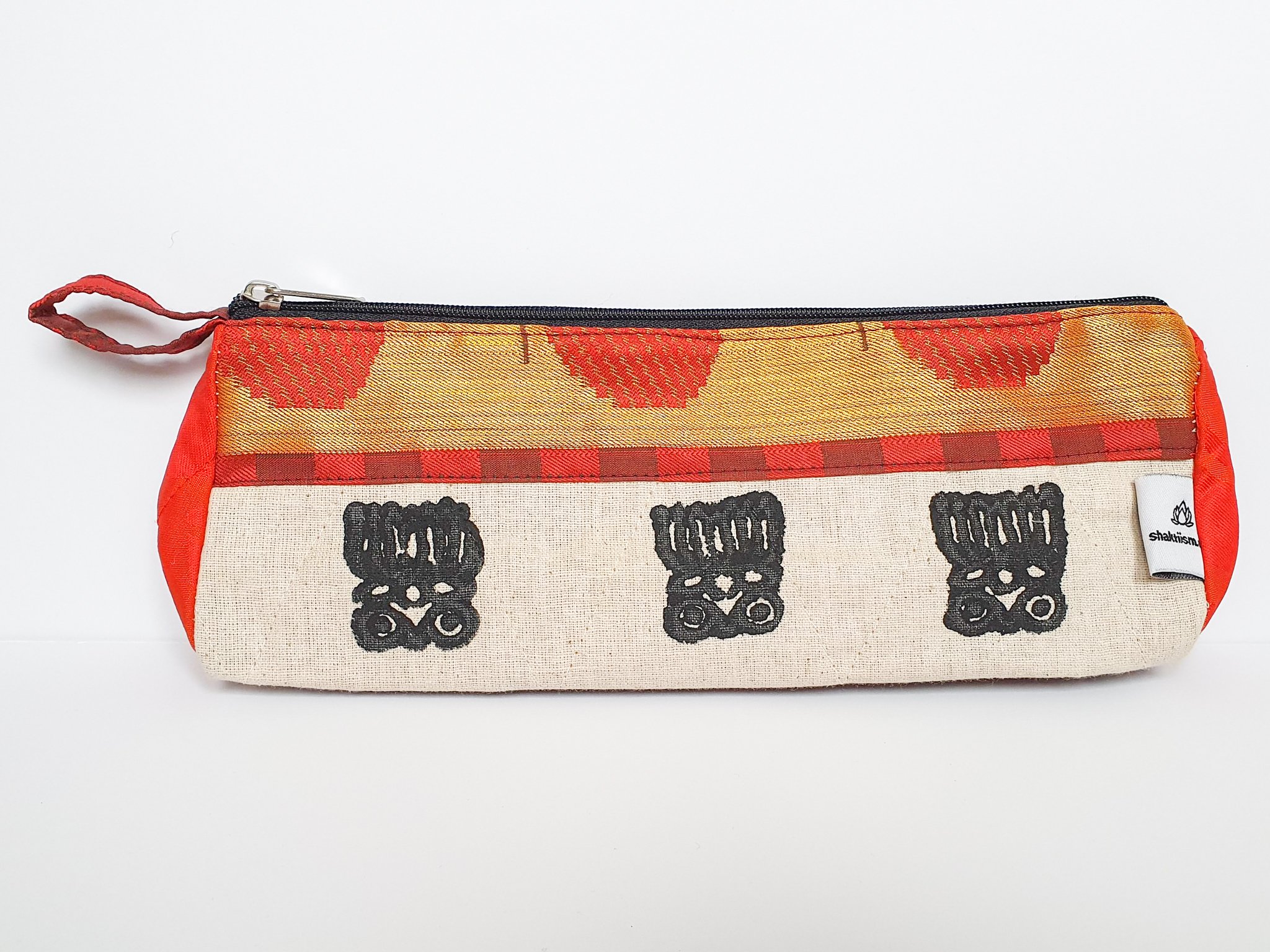 A vibrant Sari Pencil Pouch made from reclaimed sari fabric, showcasing unique patterns and colors, ethically handmade by artisans in India.