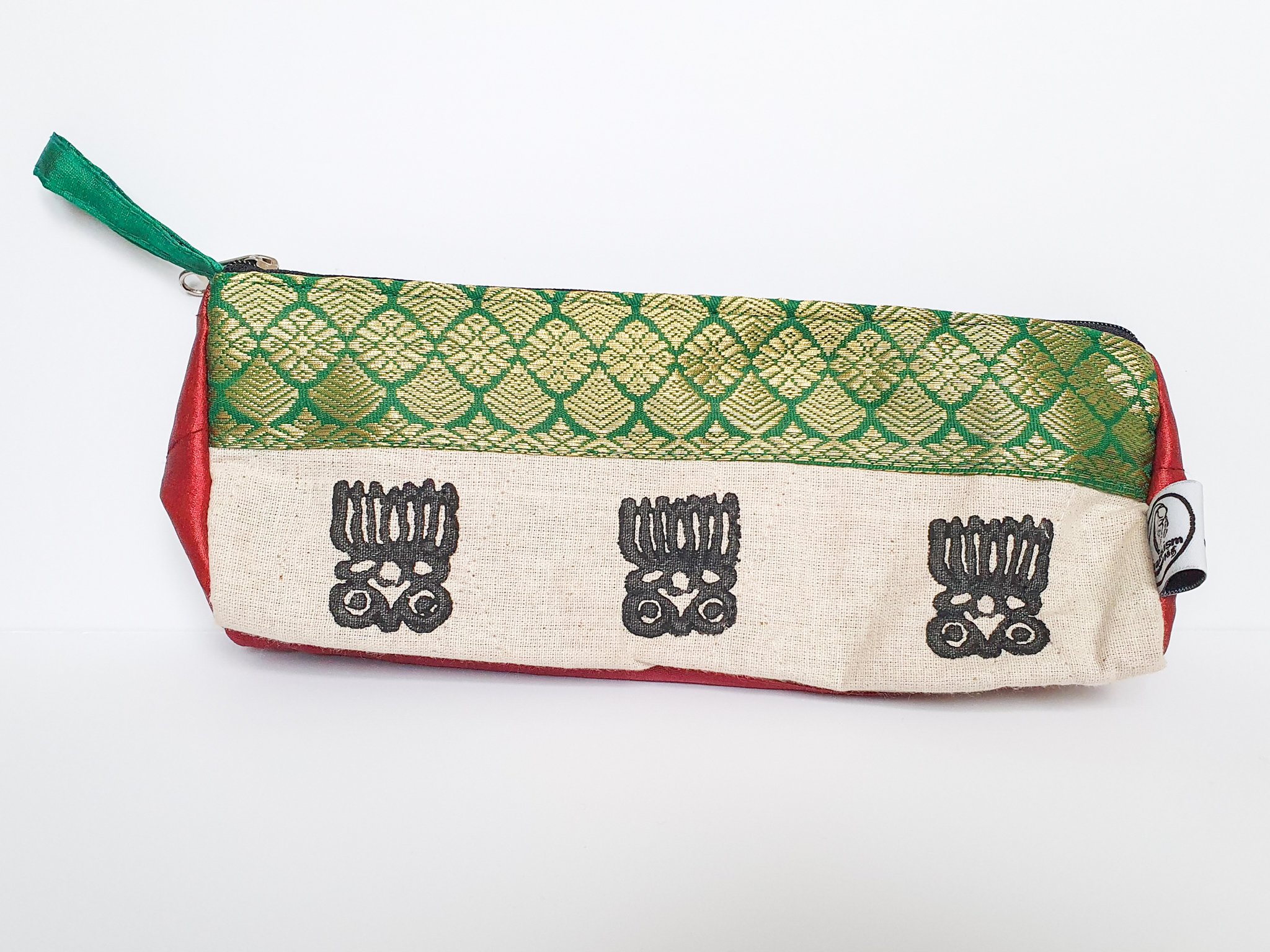 A vibrant Sari Pencil Pouch made from reclaimed sari fabric, showcasing unique patterns and colors, ethically handmade by artisans in India.