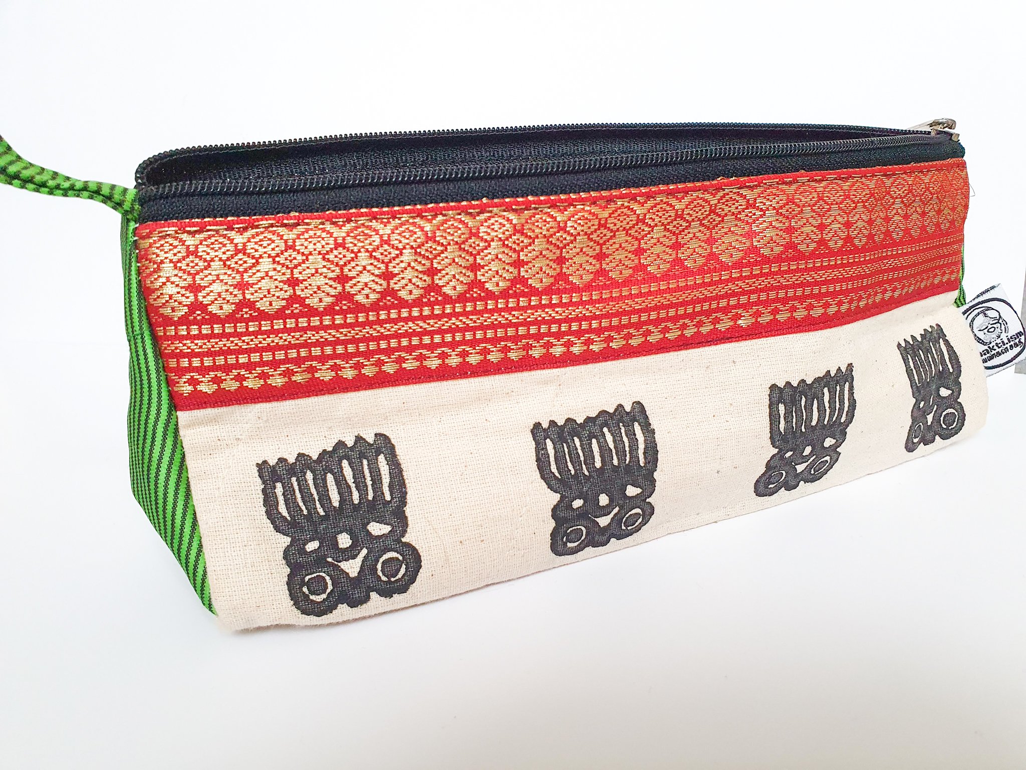 A vibrant Sari Pencil Pouch made from reclaimed sari fabric, showcasing unique patterns and colors, ethically handmade by artisans in India.