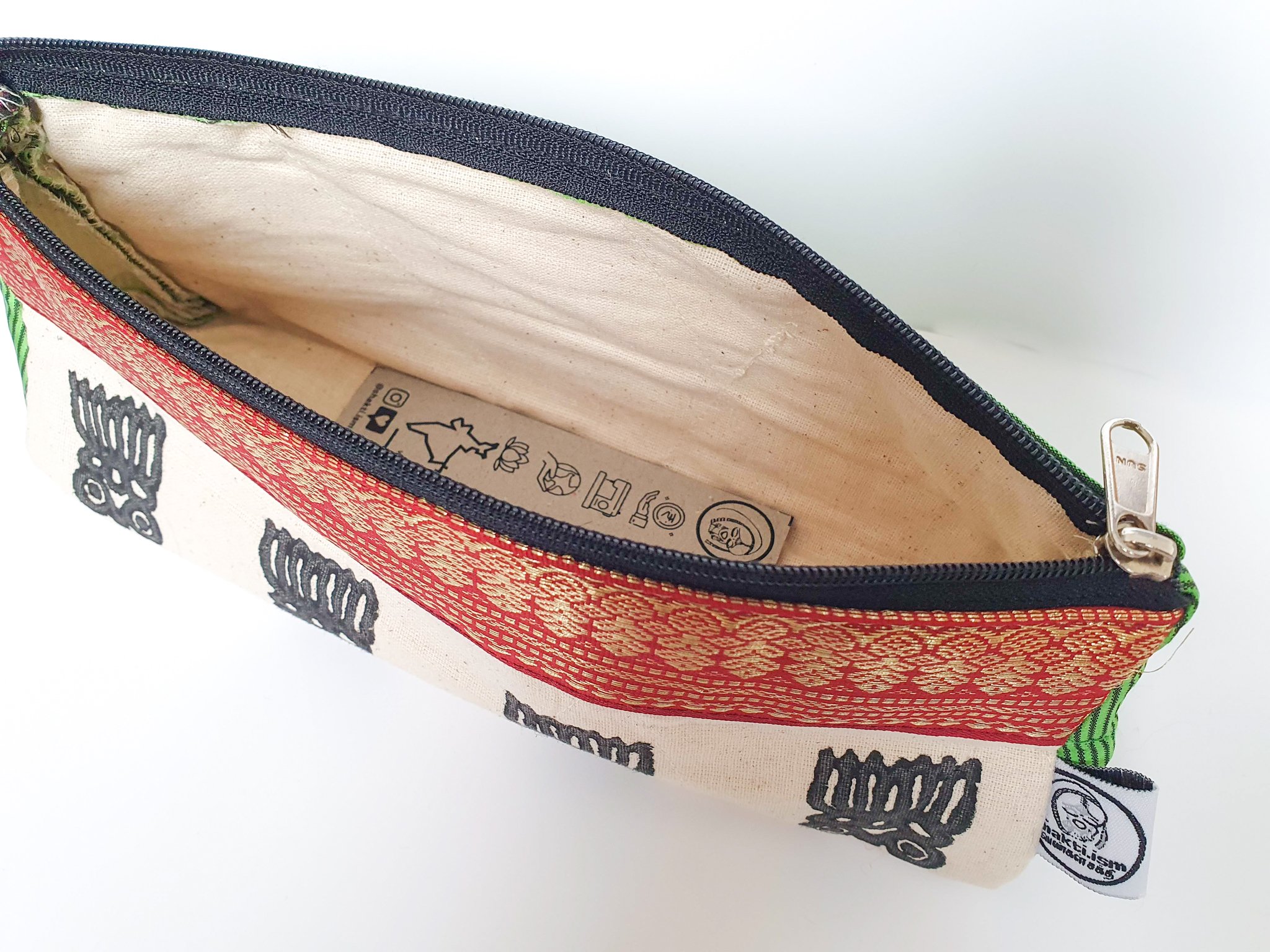 A vibrant Sari Pencil Pouch made from reclaimed sari fabric, showcasing unique patterns and colors, ethically handmade by artisans in India.