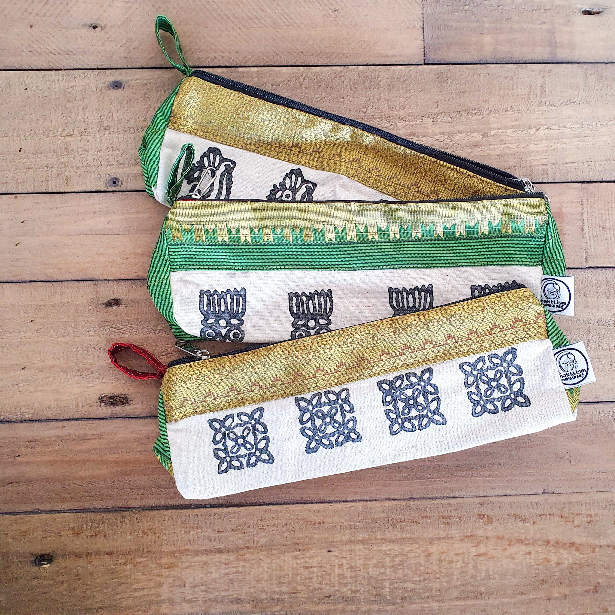 A vibrant Sari Pencil Pouch made from reclaimed sari fabric, showcasing unique patterns and colors, ethically handmade by artisans in India.