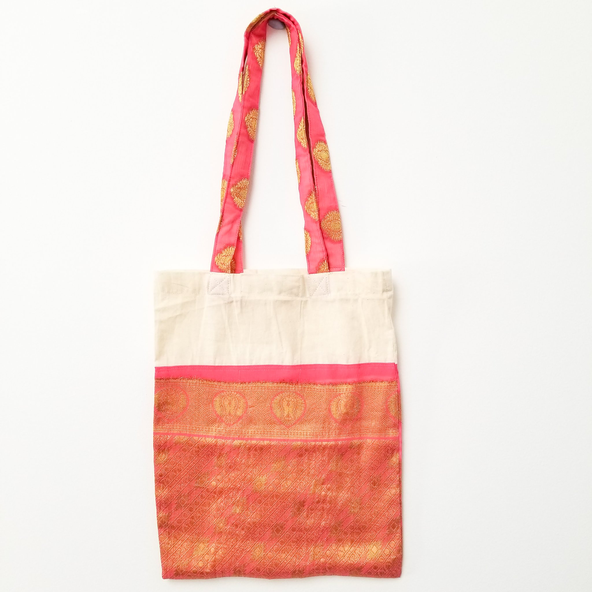 A vibrant Sari Tote Bag handcrafted from repurposed saris, showcasing unique patterns and colors, perfect for shopping and daily use.