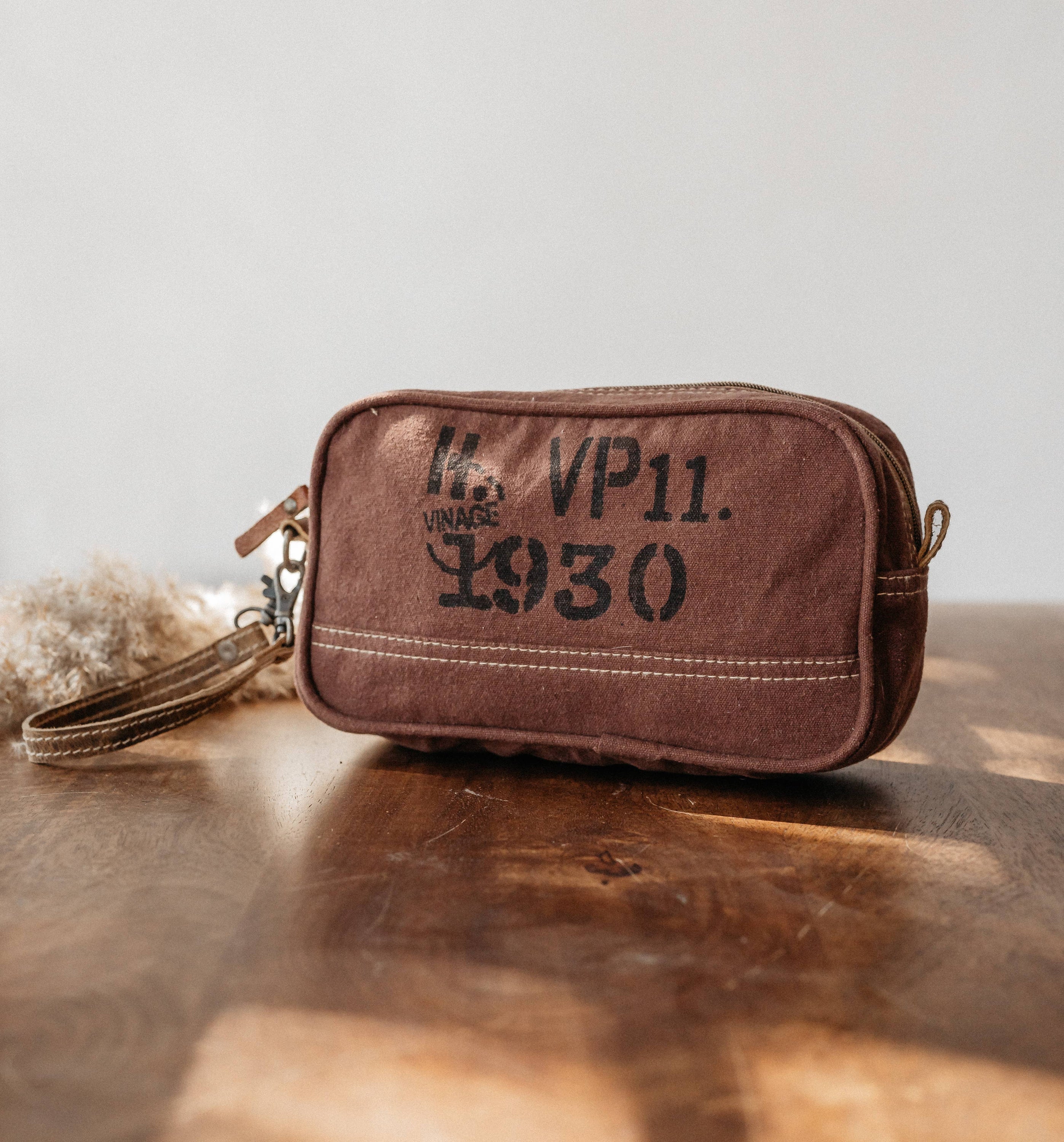 Sevio Dopp Kit made from upcycled canvas featuring a vintage print, ideal for organizing essentials like makeup and personal items.