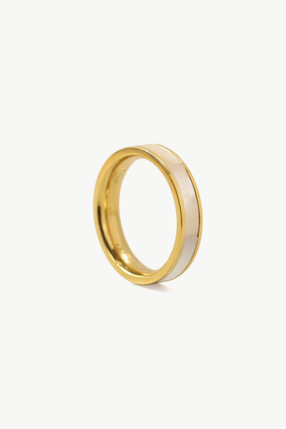 A stylish Shell Gold-Plated Ring featuring natural shell accents and a titanium steel base, elegantly displayed on a ghost mannequin.