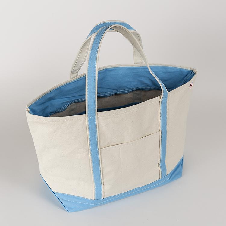 ShoreBags Classic Tote Large featuring reinforced handles and zippered top, ideal for beach and grocery use.