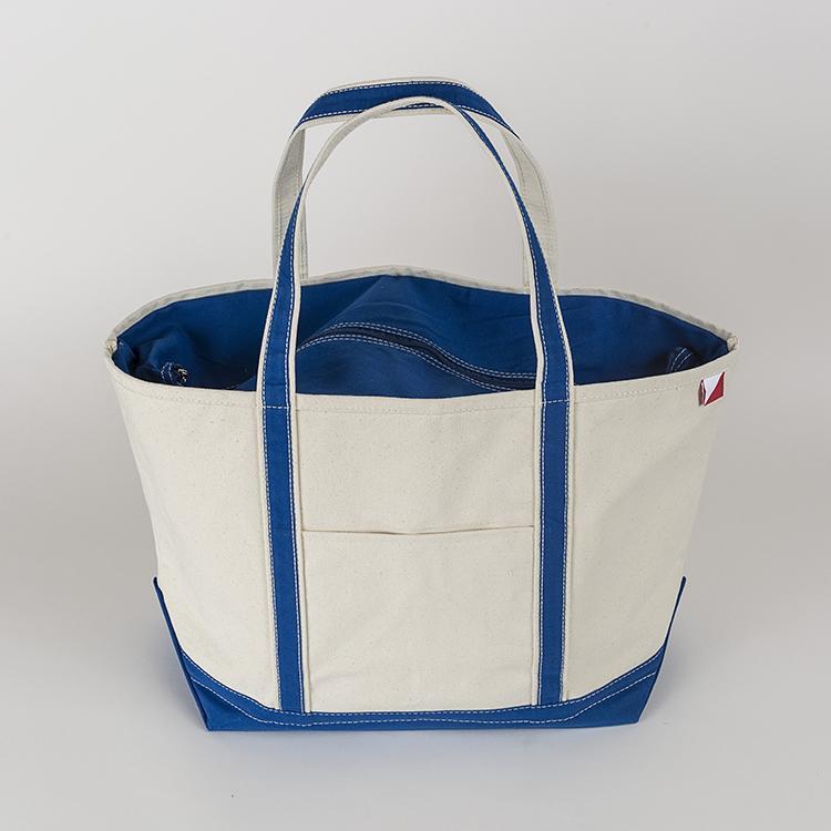 ShoreBags Classic Tote Large featuring reinforced handles and zippered top, ideal for beach and grocery use.