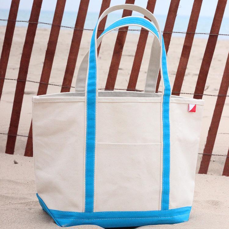 ShoreBags Classic Tote Large featuring reinforced handles and zippered top, ideal for beach and grocery use.