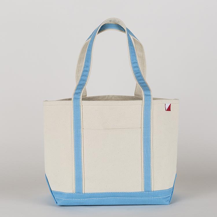 ShoreBags Classic Tote Medium in vibrant colors with double bottom and reinforced handles, showcasing its spacious interior and 360-degree pockets.