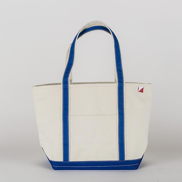 ShoreBags Classic Tote Medium in vibrant colors with double bottom and reinforced handles, showcasing its spacious interior and 360-degree pockets.