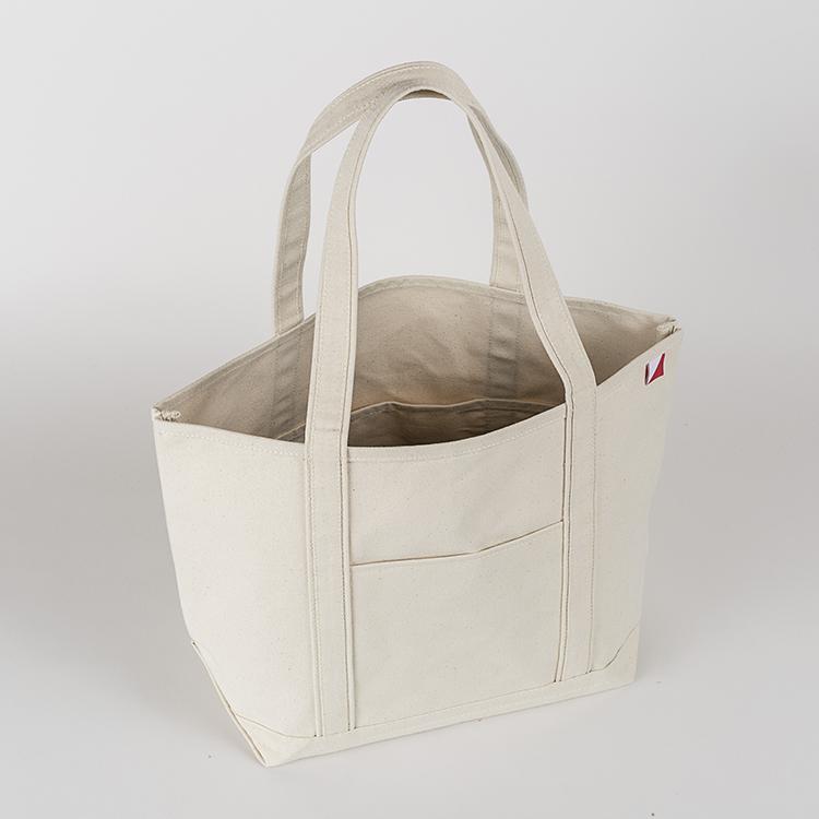 ShoreBags Classic Tote Medium in vibrant colors with double bottom and reinforced handles, showcasing its spacious interior and 360-degree pockets.