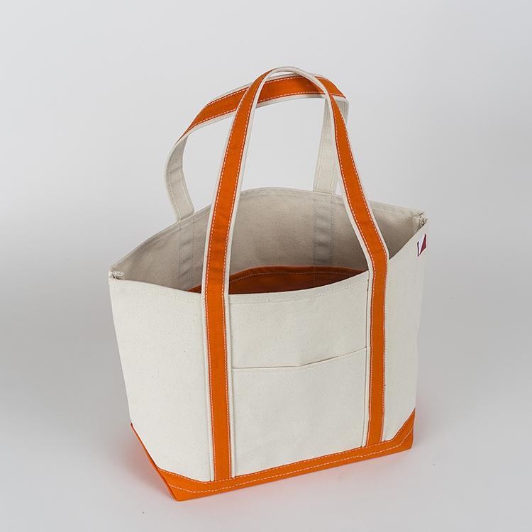 ShoreBags Classic Tote Medium in vibrant colors with double bottom and reinforced handles, showcasing its spacious interior and 360-degree pockets.