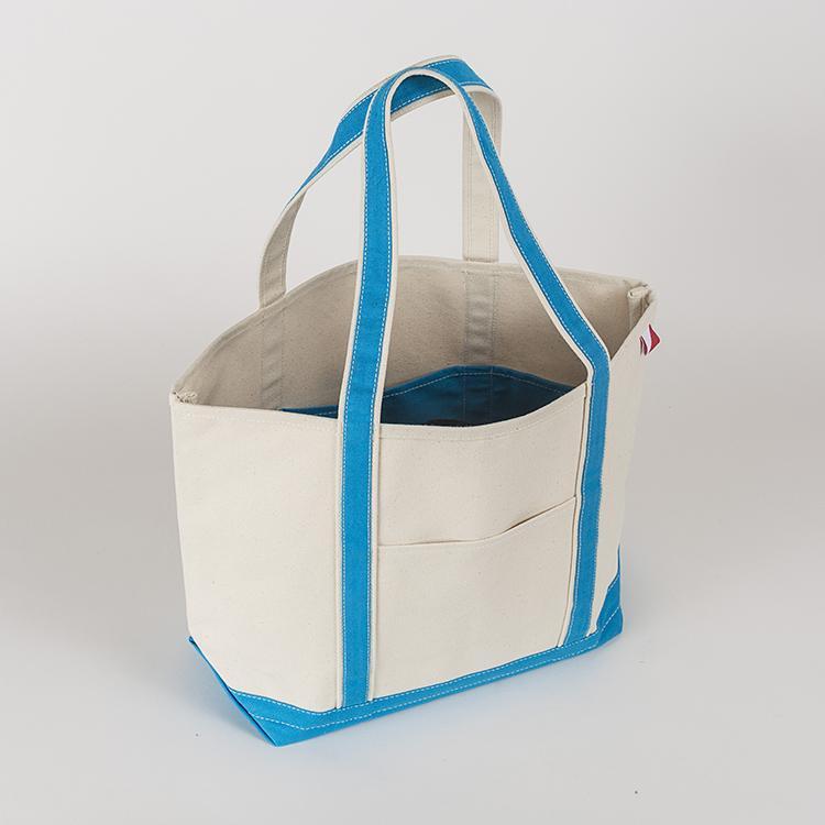 ShoreBags Classic Tote Medium in vibrant colors with double bottom and reinforced handles, showcasing its spacious interior and 360-degree pockets.