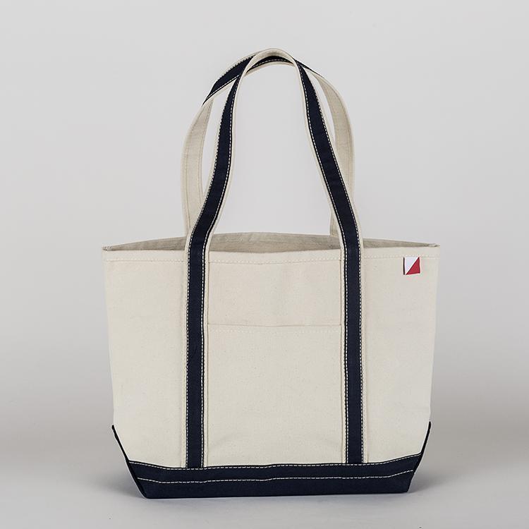 ShoreBags Classic Tote Medium in vibrant colors with double bottom and reinforced handles, showcasing its spacious interior and 360-degree pockets.