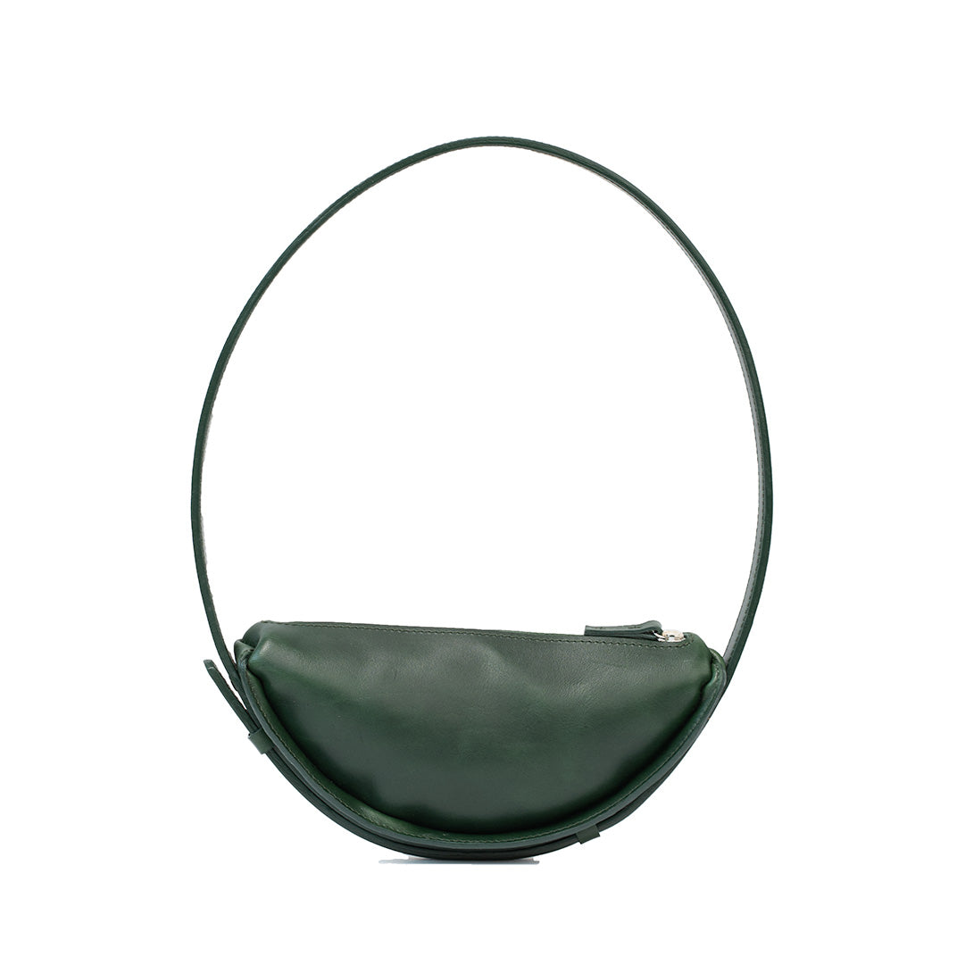 Thales Shoulder Bag in Forest Green, handcrafted leather with a unique crescent shape, showcasing its spacious interior and premium craftsmanship.