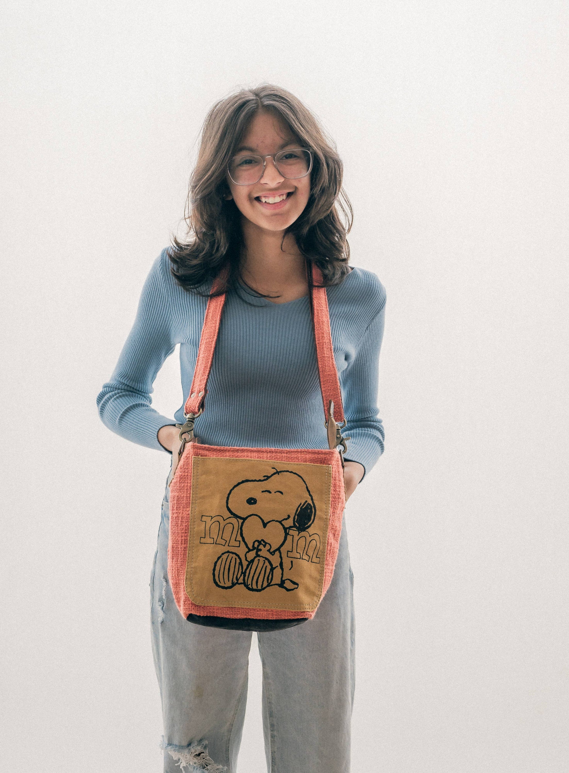 Sicho Crossbody bag featuring cotton fabric, upcycled canvas, and leather with a cute print, designed for moms and kids.