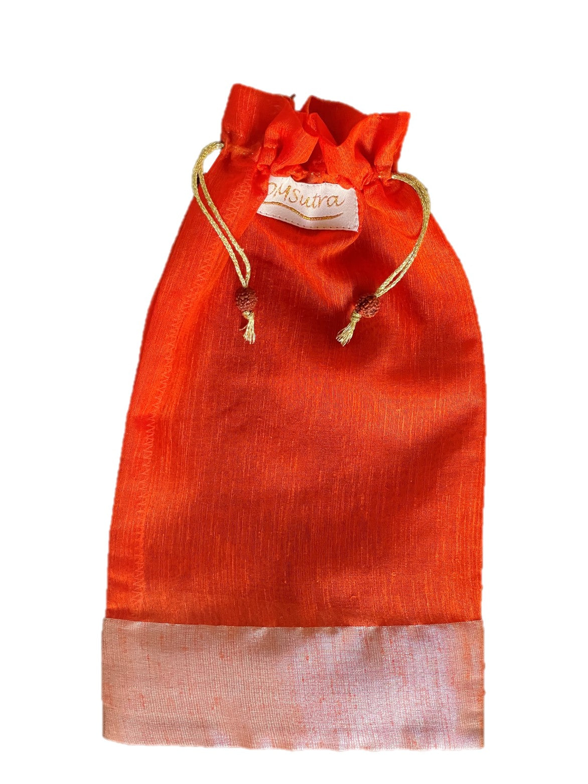 A beautifully handcrafted silk gift bag from Varanasi, India, showcasing intricate stitching and vibrant colors.