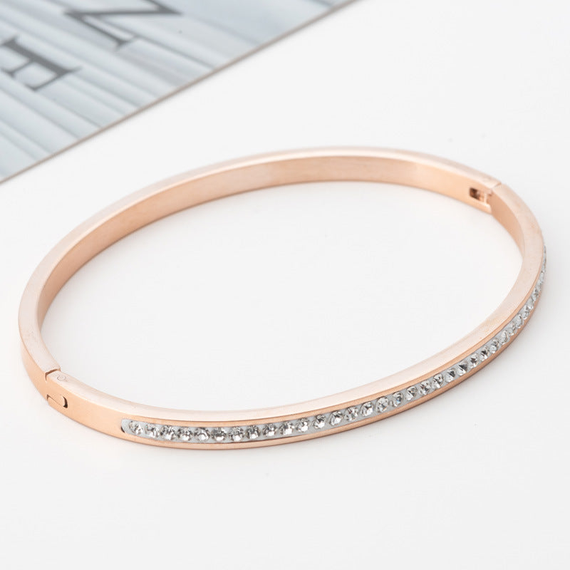 Single Row Stainless Steel Bracelet featuring sparkling rhinestones in various colors including steel, gold, and rose gold.