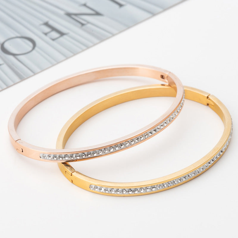 Single Row Stainless Steel Bracelet featuring sparkling rhinestones in various colors including steel, gold, and rose gold.