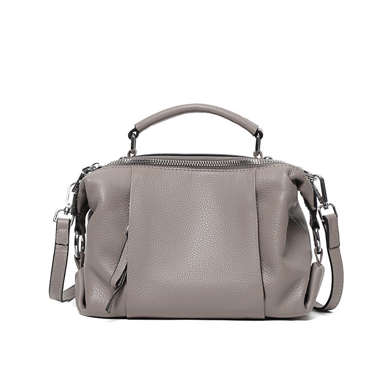 Single-shoulder solid color leather messenger bag for ladies, showcasing its stylish design and high-quality PU leather material.